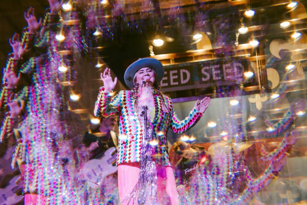 Mia singing on stage